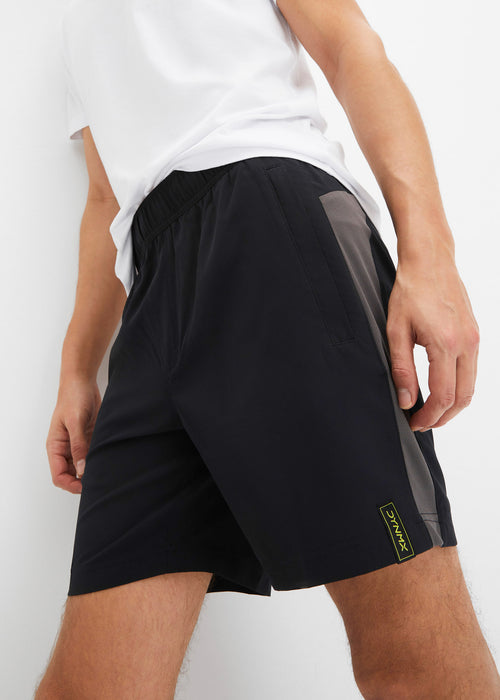 Športne kratke hlače z žepi z zadrgami iz hitro sušečega materiala