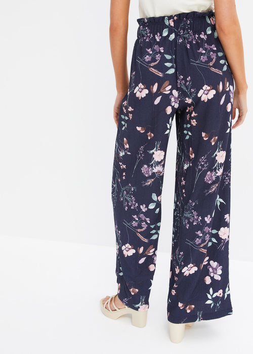 Plisirane hlače s cvetličnim potiskom