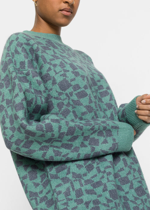 Dolg pleten pulover z geometričnim vzorcem