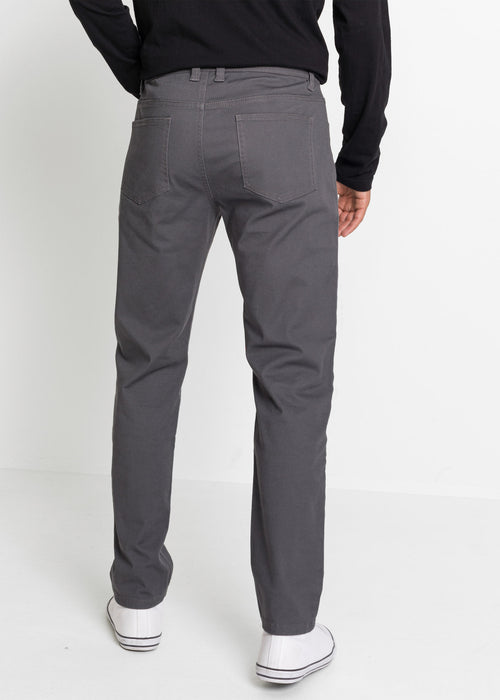 Klasične stretch hlače z okrasnimi žepi z zadrgami v spodaj ozkem kroju