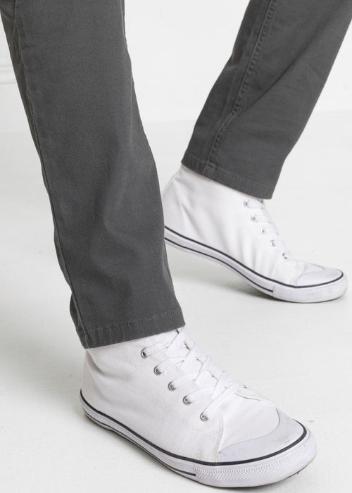 Klasične stretch hlače z okrasnimi žepi z zadrgami v spodaj ozkem kroju