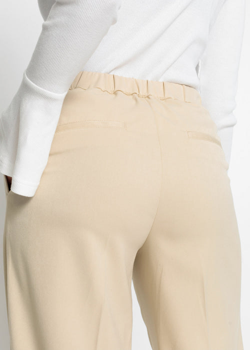 Široke hlače z všitki v pasu