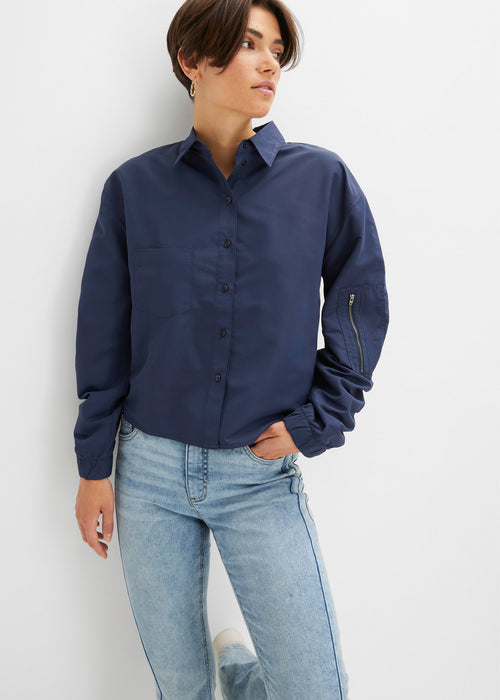 Bluza s patentno obrobo in žepi