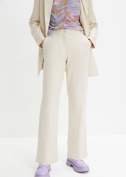 V pasu visoko krojene platnene hlače z všito elastiko
