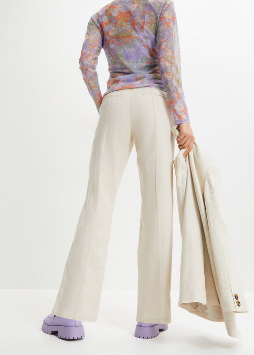 V pasu visoko krojene platnene hlače z všito elastiko