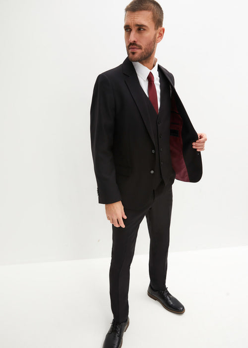 Moška obleka v ozkem kroju: suknjič, hlače, telovnik in kravata